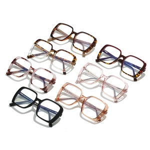 Large vintage TR blue light blocking glasses in seven assorted colors on a white background
