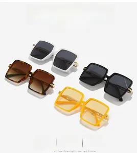 Detail of four retro oversized rimless sunglasses featuring textured metal chain temples