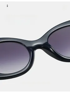 Detail of ergonomic one-piece nose pads on black oversized cat eye sunglasses