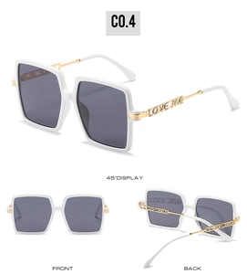 Detailed view of square rimless sunglasses with gold LOVE ME rhinestone temples
