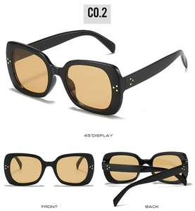 Detail of square sunglasses with thick black frames and classic metal stud rivets