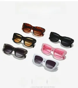 Collection of cat-eye sunglasses in six colors with metal stud details on white background