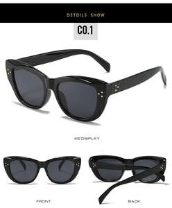 Detailed views of vintage black cat-eye sunglasses with golden triple-stud metal accents