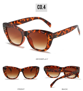 Detail view of retro cat-eye sunglasses with tortoiseshell frames and gradient lenses