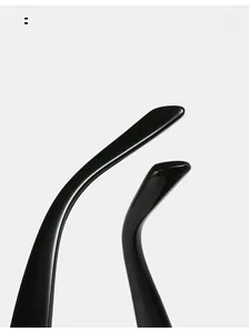Close-up of high-gloss black curved temples of cat-eye sunglasses for a comfortable fit