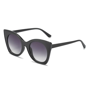 Fashionable oversized cat eye sunglasses with black frames and gradient grey lenses for women
