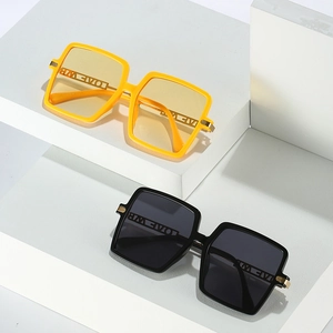 Modern oversized square sunglasses with gold LOVE hollow temple detail in yellow and black