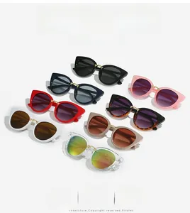 Collection of cat-eye sunglasses in multiple colors with stylish gold metal bridges