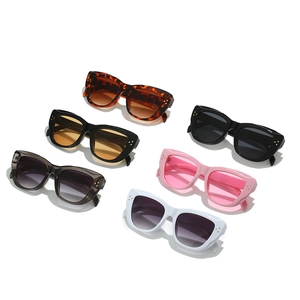Collection of retro cat-eye oversized sunglasses in multiple colors with metal accents