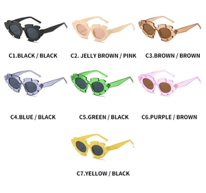 Detail of sunflower shape sunglasses in seven color variants with resin frames