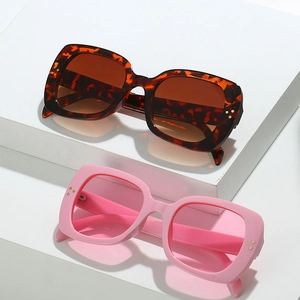 Fashionable square frame sunglasses with gold stud accents in tortoiseshell and pink colors