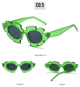 Three views of green flower-shaped sunglasses with translucent frames and dark lenses
