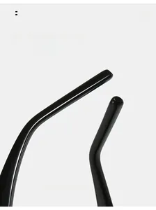 Macro shot of curved black glossy sunglasses legs for ergonomic comfort and modern style