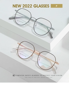 Detail of lightweight blue light blocking glasses in silver and rose gold metal frames
