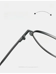 Detail of durable texture hinge with screw fixing on ultra-light black optical glasses