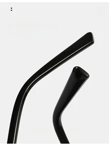 Detail of ergonomic curved black glossy sunglass temples for comfortable wear