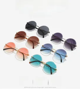 Detail of round rimless sunglasses with gradient lenses in multiple stylish colors