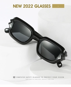 Detail of cyber-punk black thick frame sunglasses with geometric angular temple joints