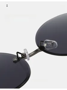 Detailed macro view of comfortable silicone nose pads on grey round sunglasses
