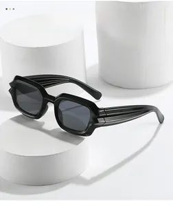 Detail of cyber-punk square sunglasses with unique wavy textured temples on white stand