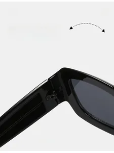 Close-up of durable metal hinge on black cyberpunk square sunglasses with wavy legs