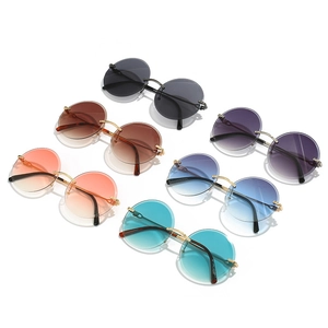 Collection of six rimless round sunglasses with gold metal bridge and gradient lenses