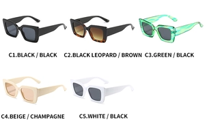 Flat lay of retro square cat-eye sunglasses in various colors on white background