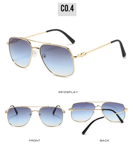 Detail view of double-bridge pilot sunglasses with gold metal frame and gradient blue lenses
