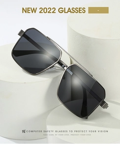 Close-up of black square sunglasses with metal double bridge on white geometric props