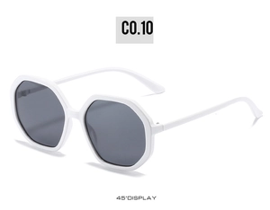 Detail view of white octagonal geometric sunglasses with dark grey polarized lenses