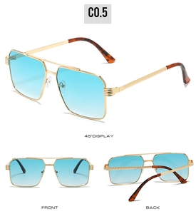 Detail view of double-bridge metal sunglasses with blue lenses and textured temples