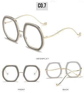 Detailed views of gold metal temple glasses with grey glitter frames in multiple angles