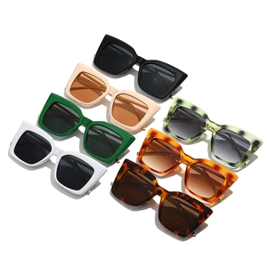 Retro Y2K oversized cat eye sunglasses in various colors and marble textures with gold accents