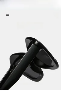 Detail of high-gloss black oversized sunglasses showing durable hinges and polished frame