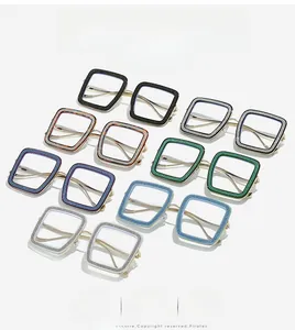 Detail view of square oversized frames with glitter finish and slim gold metal temples