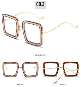 Detail view of square tortoiseshell frames with silver accents and wavy gold temples