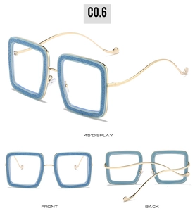 Detail of square sky blue glitter frames with slim wavy gold metal temples