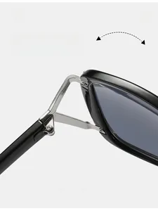 Detail of durable reinforced metal hinge on black oversized sunglasses with macro view