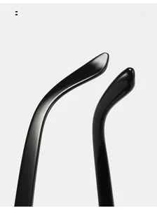 Macro view of curved glossy black sunglasses legs with ergonomic arc design for comfort