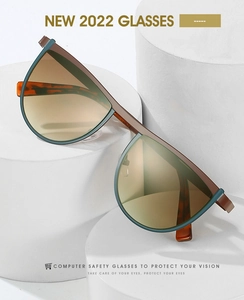 Detail of trendy cat-eye glasses with blue frames and brown tortoiseshell pattern temples