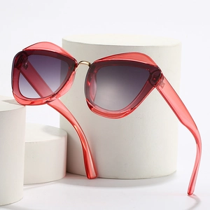 Modern cat-eye oversized sunglasses with red frames and purple gradient lenses