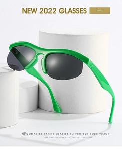 Detail view of bright green sporty half-frame sunglasses with grey lenses on white pedestal