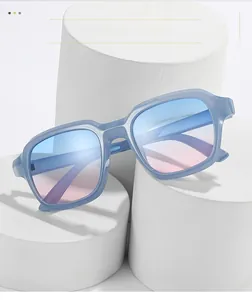 Detail of oversized light blue sunglasses with blue-pink gradient lenses on white display