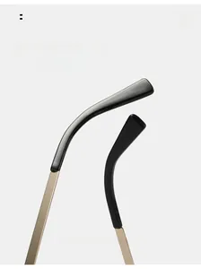 Detail of curved metal and acetate eyewear temples designed for ergonomic wearing comfort