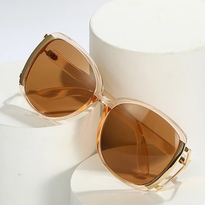 Fashion oversized sunglasses with champagne resin frames and amber tinted lenses