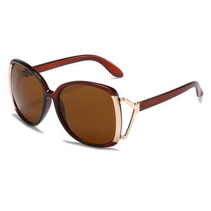 Vintage oversized amber sunglasses with brown lenses and golden metal accents