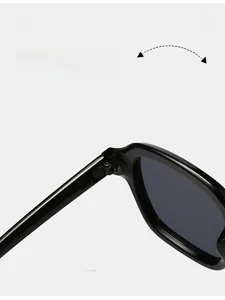 Macro shot of durable metal hinge detail on premium black oversized sunglasses