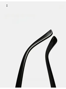 Detailed view of curved ergonomic temples on black oversized sunglasses for comfortable wear