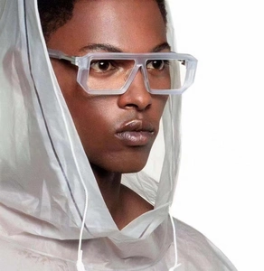 Close-up of matte grey geometric square sunglasses worn by model in future fashion style