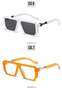 Detailed 45-degree view of geometric hexagonal sunglasses in white and translucent orange